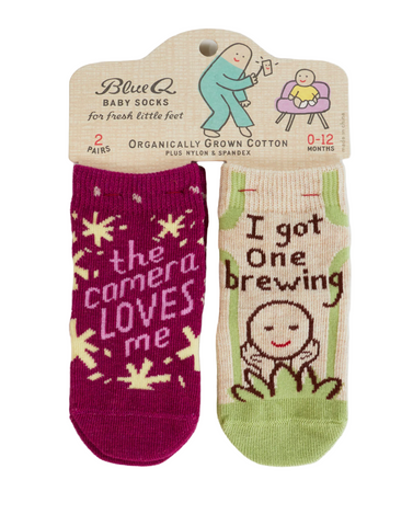 The Camera Loves Me/ I Got One Brewing Baby Socks